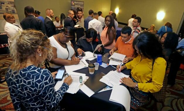 15 2015 job seekers attend a job fair in Miami Lakes Fla. The Labor Department reports on the number of people who applied for unemployment benefits for the week ending July 11 on Thursday