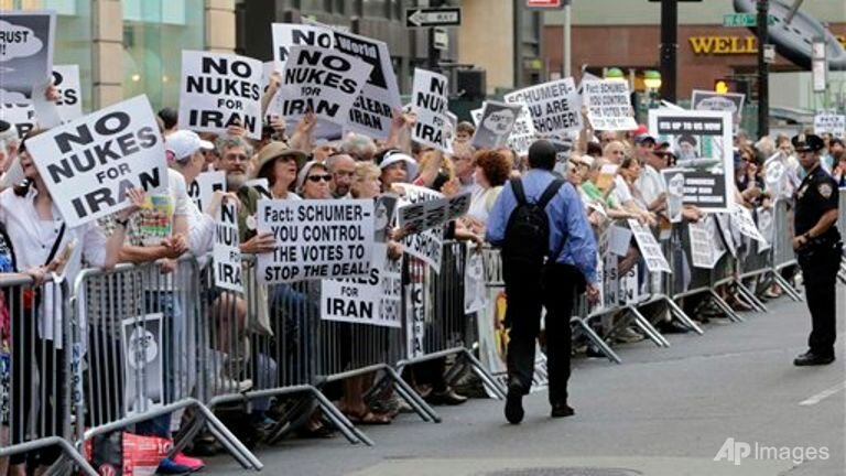 Supporters line seventh avenue during the 'Stop Iran' protest near Times Square in New York. Enlarge Caption