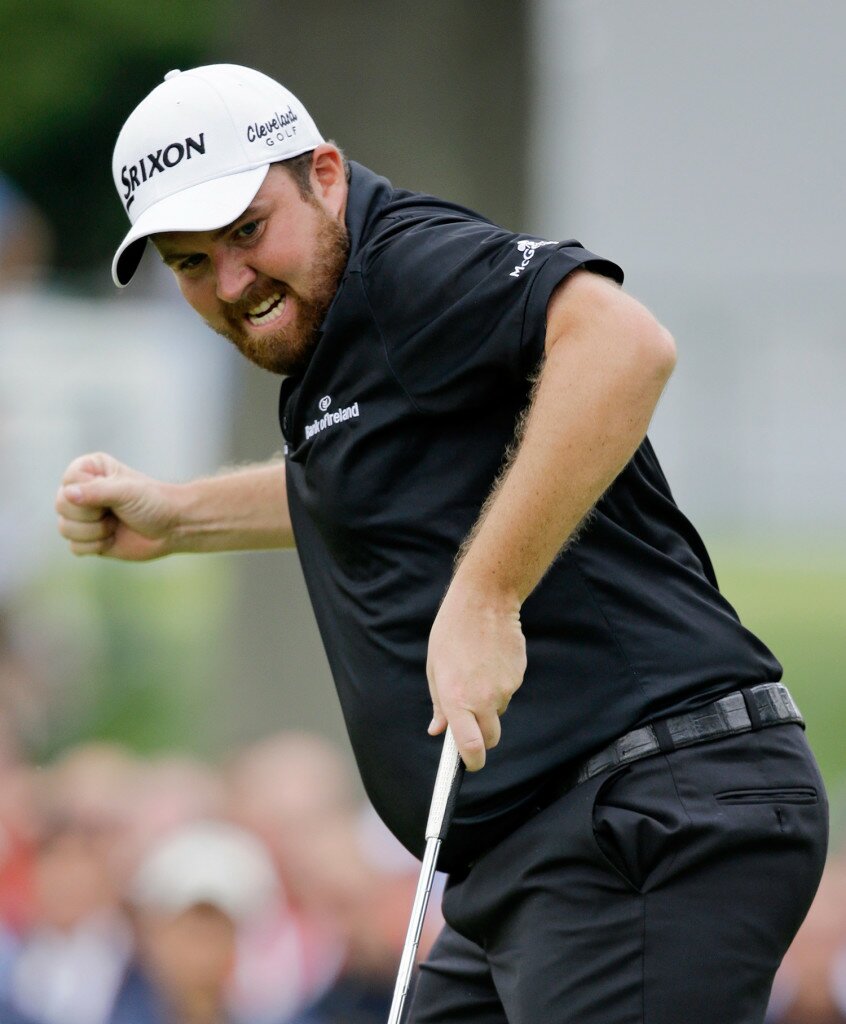 Shane Lowry from Ireland pumps his fist as he watches his birdie putt on the 18th hole to win the Bridgestone Invitational golf tournament at Firestone Country Club Sunday in Akron Ohio. The Associated Press