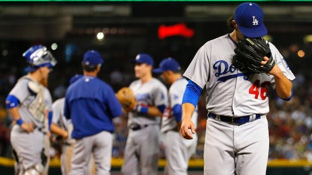 Dodgers trade Daniel Coulombe to A’s for cash photo